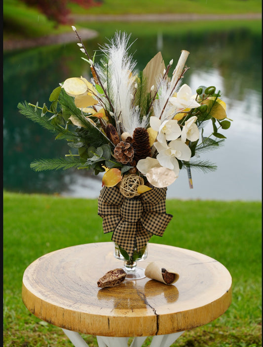 Neutral flower arrangement with checked bow in glass vase and resin water