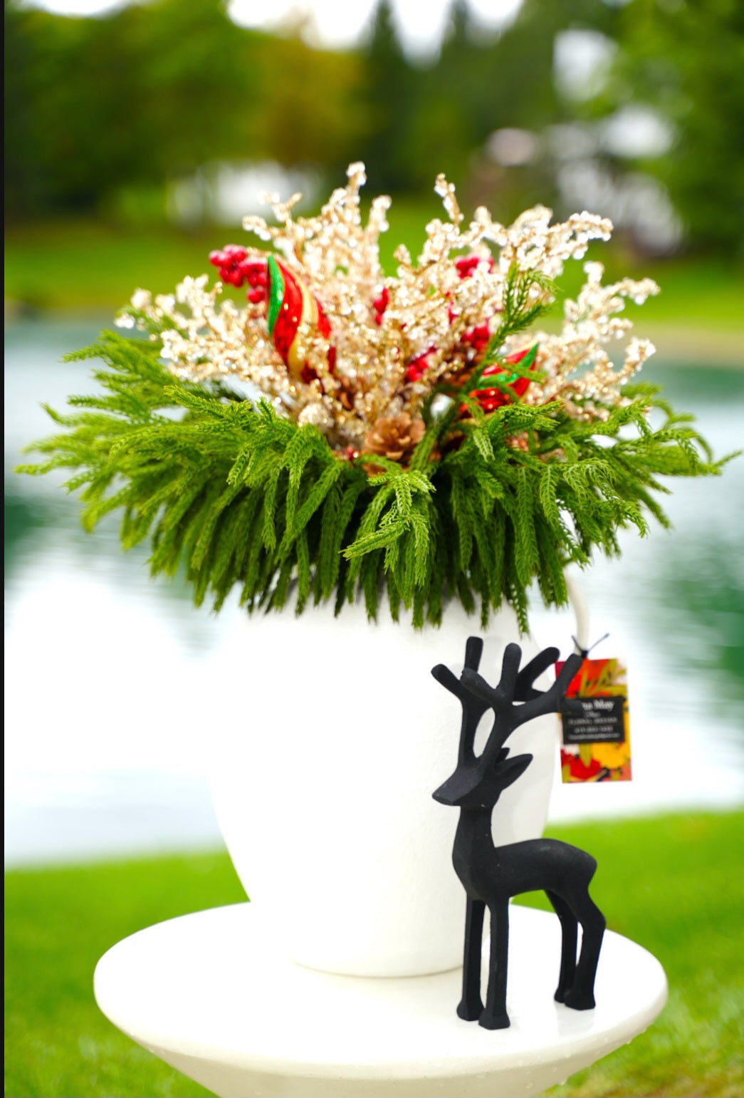 White ceramic vase with Holiday florals